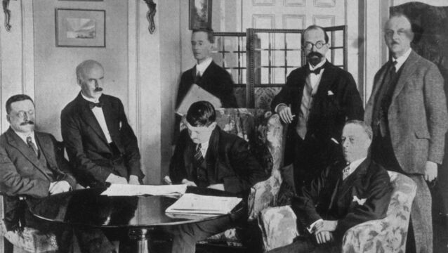<p>Members of the Irish delegation at the signing of the Irish Free State Treaty on December 6th, 1921. The delegation includes, seated from left, Sinn Fein founder Arthur Griffith, E.J. Duggan, Irish Minister for Finance Michael Collins and politician Robert Barton. Standing, from left, are Robert Erskine Childers, lawyer George Gavan Duffy and John Chartres. Picture: Topical Press Agency/Hulton Archive/Getty Images</p>