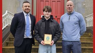 <p>Iarla Dunford, who completed his Leaving Cert in St Muredach’s College, Ballina last year, was recently presented with the UCD Entrance Scholar Award. He is pictured here with Wayne Walsh, the principal of St Muredach’s College (left) and Alan Conmy (right), who was Iarla’s history teacher.</p>