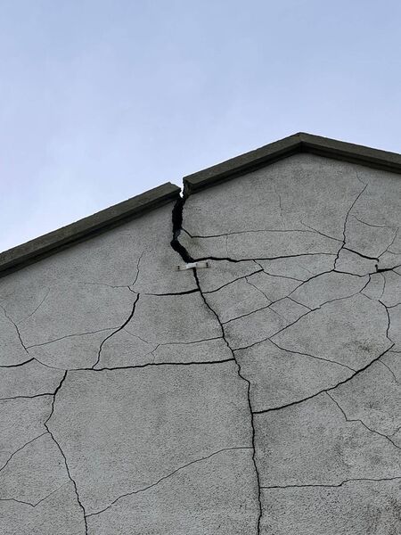 The gable wall of this house at Cois Abhainn has cracked all the way up to the roof cap. 