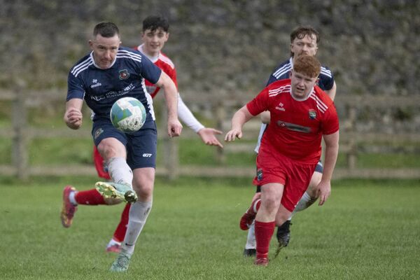 Paddy Mulchrone of Glenhest Rovers gets his shot in, watched by Gary Mellett Connolly of Ballinrobe Town, right. PictureL John Corless