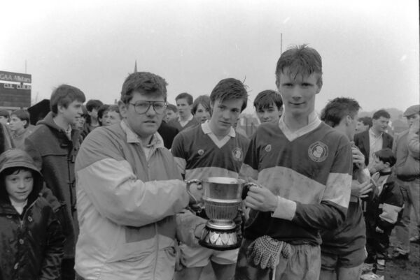 The late Michael McDonnell, the then secretary of the Connacht Colleges GAA Committee, presented the cup to Balla captain Gareth Golding after their Connacht Colleges senior 'B' football success in 1990.	Picture: Frank Dolan