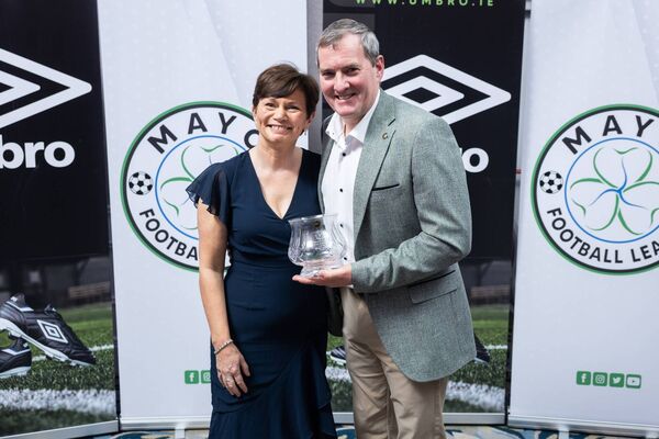 Tom Jennings and his wife Fiona with the Appreciation Award for 2025 from the Mayo Football League. Picture: Ryan Gallagher