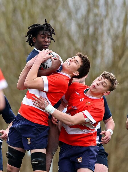 Sligo Grammar's Kelvin Kalu and Oisin Breslin of St Muredach's compete for the ball. Picture: INPHO/Tom O’Hanlon