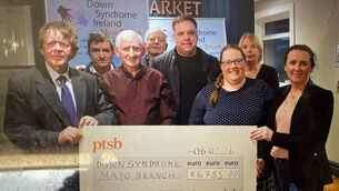 <p>Pictured in the Moy Hotel, Foxford, at the presentation of the proceeds from the recent Coolegrane Christmas Lights Foxford appeal in aid of Down Syndrome Ireland Mayo Branch are Kevin Hughes, (left), Coolgrane Christmas Lights, presenting a €6,755 cheque to Deirdre O’Malley, (right), Down Syndrome Mayo. Also included back, from left: Brendan Hughes, (Coolgrane Christmas Lights); Pat Boyle, Stephen Barrett, William Noone, Paula Murphy and Kathrina Barrett. </p>