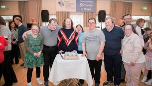 <p>Martin McLoughlin, pictured far right, with friends and fellow members of Down Syndrome Ireland at Mayo branch 50th anniversary party</p>