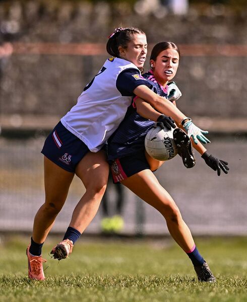 Anna Ryan of Moate Community School has a shot blocked by Saoirse McGing of Sacred Heart School, Westport.
