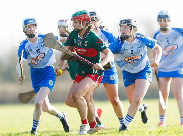 Mayo's Ava Dooley is challenged by Sioneen Morgan and Lucy Kindon of Monaghan.