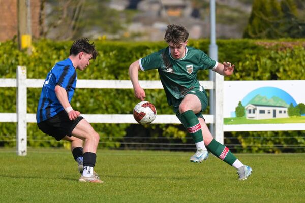 Mayo's Ethan Hosty rounds Athlone defender James Murtagh. Picture: John Corless Mayo's Ethan Hosty rounds Athlone defender James Murtagh. Picture: John Corless