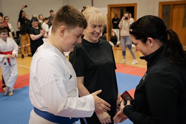 Mayo Karate Academy children's liason officer Ann Hanahoe presenting awards to Conor Takagaki and Dympna Doyle following Parents Kata Event. Mayo Karate Academy children's liason officer Ann Hanahoe presenting awards to Conor Takagaki and Dympna Doyle following Parents Kata Event.