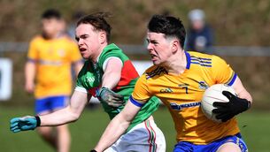 <p>Knockmore’s Fergal Keane gathers the ball ahead of Ballina Stephenites Niall Treacy during the Sweeney Cup Senior Football Final at St. Joseph’s Park, Knockmore, last Sunday. Pictures: David Farrell Photography </p>