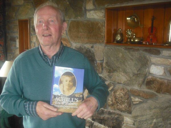 The late John Twin McNamara with a book about Achill's 'forgotten heroine' Eva O'Flaherty, written by Mary J Murphy. The late John Twin McNamara with a book about Achill's 'forgotten heroine' Eva O'Flaherty, written by Mary J Murphy.