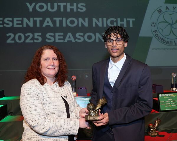 Marian Robinson, Mayo Football League, presents the U18 Division One Golden Boot award to Ballyhaunis Town's Marcos Luis de Moraes. Marian Robinson, Mayo Football League, presents the U18 Division One Golden Boot award to Ballyhaunis Town's Marcos Luis de Moraes.