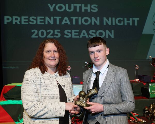 Marian Robinson, Mayo Football League, presents the U17 Division One Golden Boot award to Iorras Aontaithe's Keelan Barrett. Marian Robinson, Mayo Football League, presents the U17 Division One Golden Boot award to Iorras Aontaithe's Keelan Barrett.