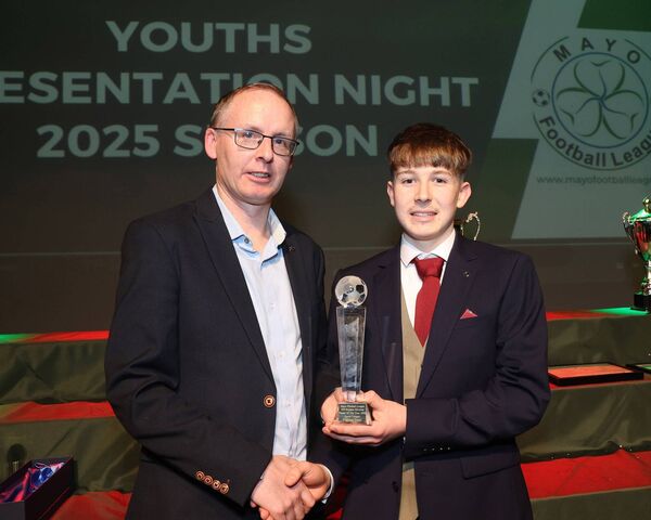 Kieran Gallagher, Mayo League, presents the U17 Premier Division Player of the Year Award to Aaron Coogan of Castlebar Town at the Youth Awards night in the TF Royal Hotel and Theatre, Castlebar. Aaron also picked up the Golden Boot award for finishing as top scorer in the division. Picture: Michael Donnelly Kieran Gallagher, Mayo League, presents the U17 Premier Division Player of the Year Award to Aaron Coogan of Castlebar Town at the Youth Awards night in the TF Royal Hotel and Theatre, Castlebar. Aaron also picked up the Golden Boot award for finishing as top scorer in the division. Picture: Michael Donnelly