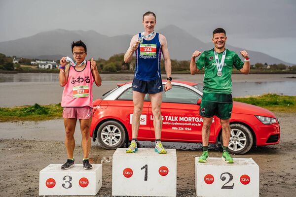 Sean Hehir, marathon winner, flanked by Pat Walsh and Man Tam who finished second and third respectively.