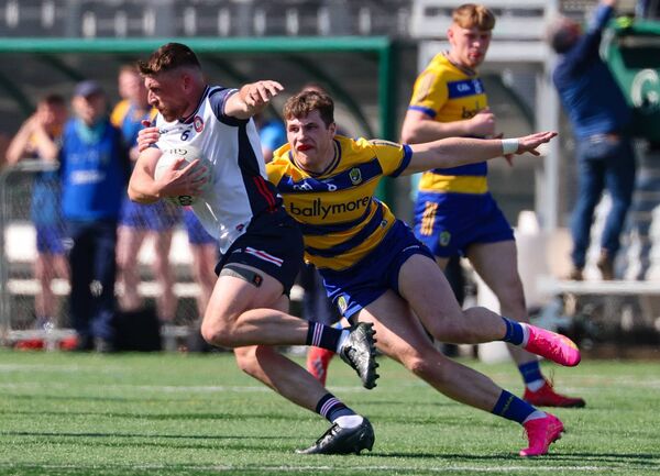 Roscommon’s Keith Doyle tackles Lahardane native Matthew Queenan who featured at centre-back for New York in the recent Connacht SFC Quarter-Final at Gaelic Park.