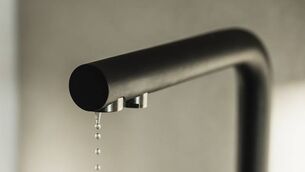 <p>Drop of water is leaking from kitchen tap.</p>