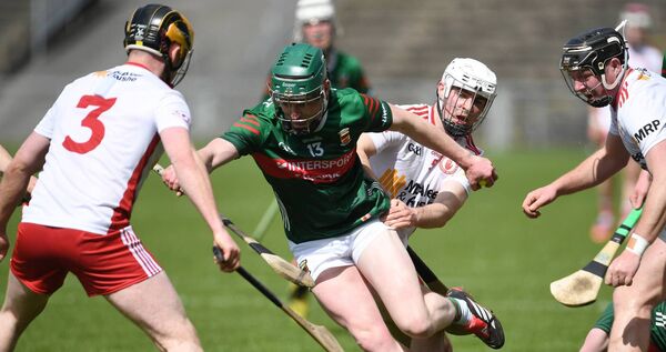 Mayo goalscorer Eoin Delaney is surrounded by Tyrone players as he heads towards goal. Picture: David Farrell