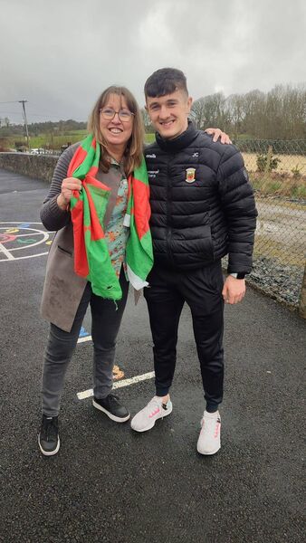 Mayo senior football captain Jack Coyne with Bernie Connell, a teacher at Logboy NS where he attended as a pupil.