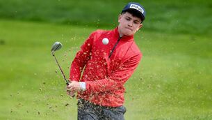 <p>Mayo's John William Burke plays out of the bunker at the Flogas Irish Boys' Amateur Open Championship.	Picture: INPHO/Ryan Byrne</p>