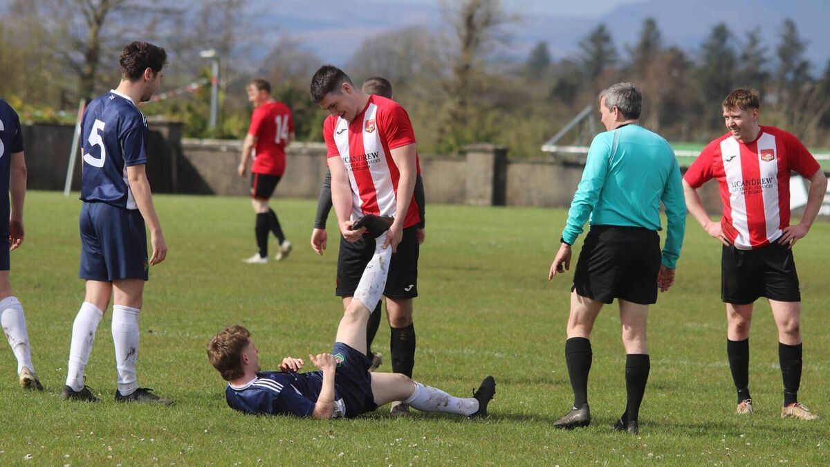 Local Notes: Sportsmanship at its best between Ballyglass FC and Glenhest players.
