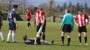 <p>Sportsmanship at its very best! Ballyglass FC striker Jack Keane comes to the aid of Glenhest player Cathal Chambers who had a severe cramp problem in a recent match. Picture by Tom Quinn</p>