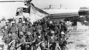 <p>Lt Noel Carey and No 3 Platoon with the UN helicopter that landed on their positions during the Battle of Jadotville. Image taken from the private collection of Lt Carey, ACC-2017, courtesy of the Military Archives</p>