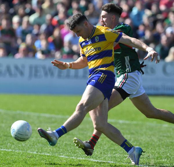 Roscommon’s Diarmuid Murtagh scores the opening goal as Mayo’s Enda Hession gives chase during last Sunday's Connacht SFC semi-final at Hastings Insurance MacHale Park, Castlebar.	Picture: David Farrell Photography 