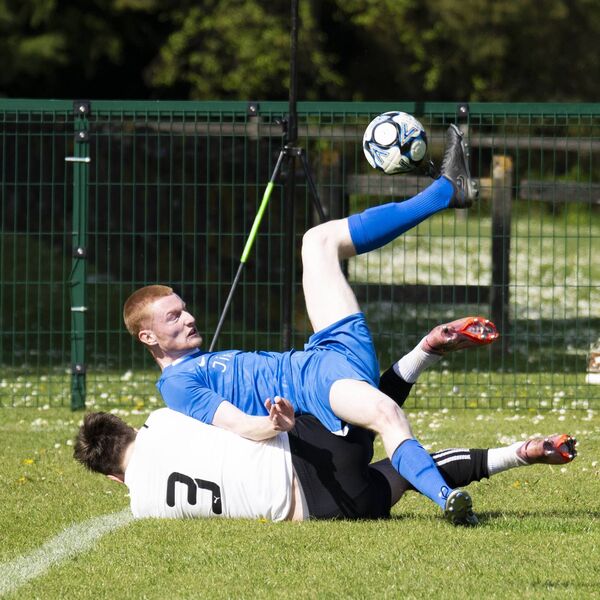 Matthew Traynor of Ballina Town tries an overhead kick with support from Ballyheane’s Gareth Dunne. Picture: John Corless