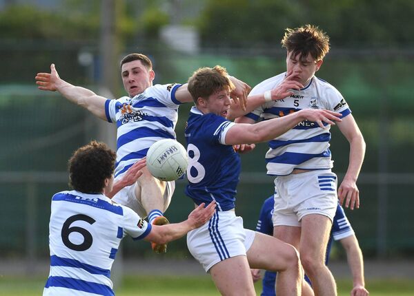 Claremorris midfielder Darragh Joyce is outnumber by Breaffy's Paul McDermott (6), Davitt Neary and Ross Connolly. Picture: David Farrell