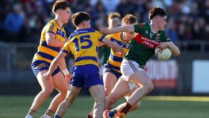 <p>Mayo's Andrew Quinn with John McGuinness of Roscommon.	Picture: INPHO/Tom O’Hanlon</p>