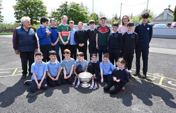 Pupils from Killawalla National School senior room are pictured with the O'Duffy Cup. Included are Sean Carter, and his grandson Jamie, and Teresa Hoban, principal.