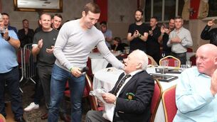 <p>Pat Benson receiving a lifetime award for 50 years on coaching, from one of his protegees, Matthew Macklin. </p>
