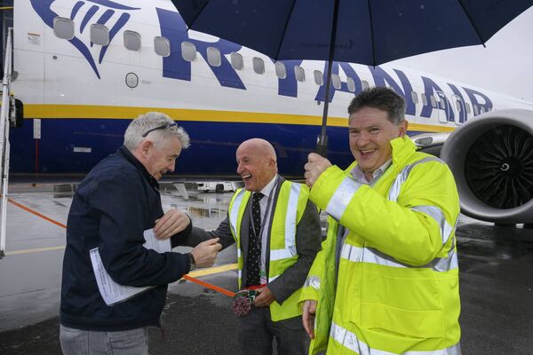Joe Gilmore holds the brolly as airport chairperson Arthur French greets Ryanair chief executive Michael O’Leary during his recent visit. 	Picture: Michael McLaughlin