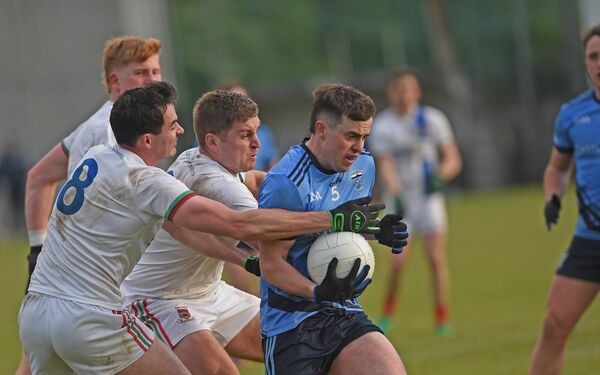 Tim Campion of Westport tries to break past the challenge of Ballina's Mikey Murray and James Doherty. Picture: Conor McKeown