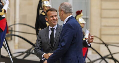 Taoiseach greeted by French president on arrival for talks in Paris