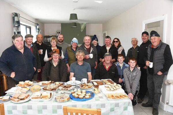 Keeping alive the true spirit of the 'meitheal', the the workers enjoyed a fine feed after the threshing. 	Pictures: John O'Grady