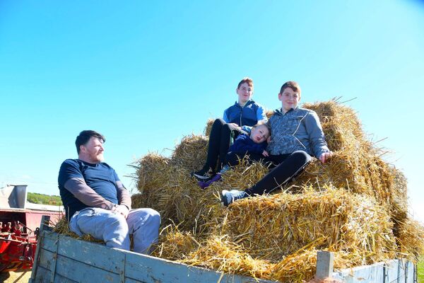 Raymond, Mel, James and Ruadhán Taylor were at the threshing in Rathlee, Easkey.