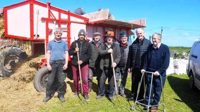 <p>Pictured beside the thresher at Rathlee in Easkey were, from left: Jim Long, Joe Lacken, Keith Usher, Frank Flannelly, Paddy Joe Walsh, Fr Joe Hogan and PJ Curley. </p>