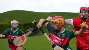 <p>Mayo's Ciara Kennedy breaking the tackle of Louth’s Lorraine Nicol during their All-Ireland Junior Camogie Championship at Adrian Feeeman Park, Tooreen. Picture courtesy of Mayo Camogie.</p>