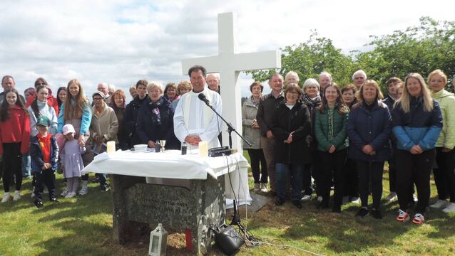 <p>Local people gathered with Fr Joseph Gavigan PP Kilmovee at Lios na Leannai in the village of Culliagh to celebrate Mass at the site of the children's graveyard to remember and pray for the eleven children who are laid to rest there. Picture James Hunt Photography.</p>