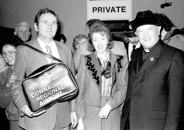 Frank and Patricia Harrington with Monsignor Horan at Knock Airport in October 1985 for the inaugural flight to Rome.