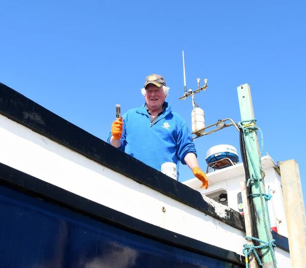 Donal Kennedy used the fine weather at the end of May to pain his boat Leah at Enniscrone Pier. Picture: John O'Grady Donal Kennedy used the fine weather at the end of May to pain his boat Leah at Enniscrone Pier. Picture: John O'Grady