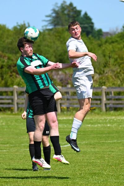 Ballyheane's Michael Fahy wins the aerial battle with Coachford’s Keith Linzell. Picture: John Corless Ballyheane's Michael Fahy wins the aerial battle with Coachford’s Keith Linzell. Picture: John Corless