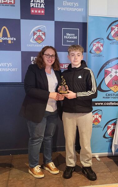 Ryan O'Malley, winner of the U13 Most Improved player award, with Castlebar RFC president Mairéad Bradley. Ryan O'Malley, winner of the U13 Most Improved player award, with Castlebar RFC president Mairéad Bradley.