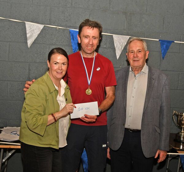 Men's 10 race winner Sean Gallagher receives his prize from Laurita Blewitt and Sean Clarke. Men's 10 race winner Sean Gallagher receives his prize from Laurita Blewitt and Sean Clarke.