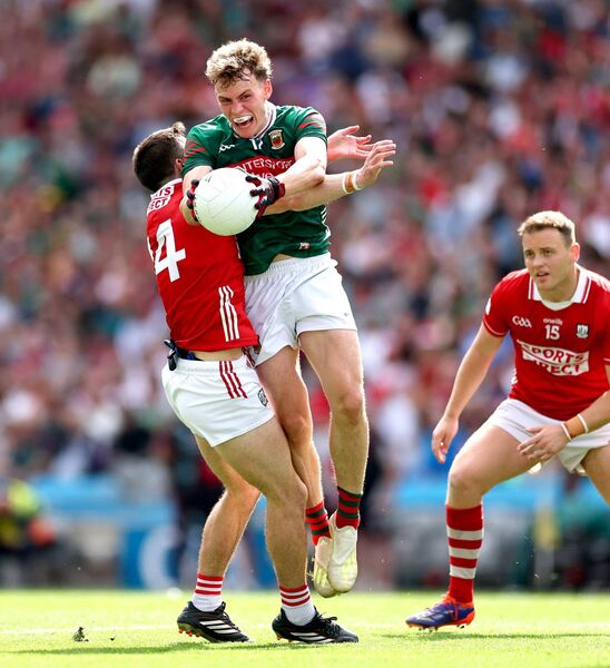 Cork’s Chris Óg Jones blocks the past of Mayo's Diarmuid Duffy. Cork’s Chris Óg Jones blocks the past of Mayo's Diarmuid Duffy.