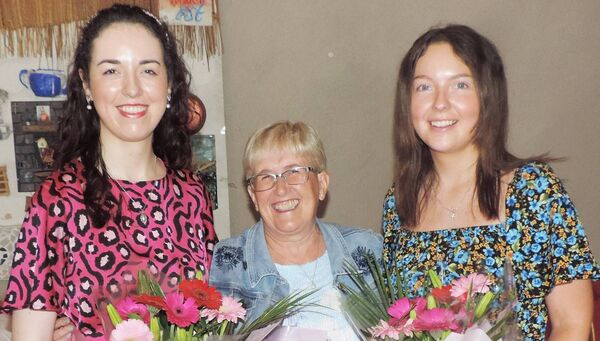 At a recent Comhaltas Session in Kilmovee Community Centre were Edel Fleming (Principal Tooreen NS) and right Breege Gleeson being presented with bouquets of flowers by Kilmovee Comhaltas Branch chairperson Ann Marie Rooney (centre) Edel Feming is Principal in Tooreen NS Ballyhaunis and Breege is National Youth Officer for Connaught. Picture James Hunt Photography.