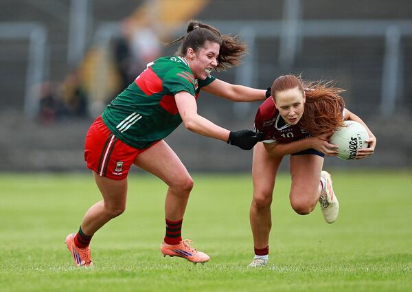 Olivia Divilly of Galway tries to shake off the attentions of Mayo defender Lynda Hanley. Olivia Divilly of Galway tries to shake off the attentions of Mayo defender Lynda Hanley.