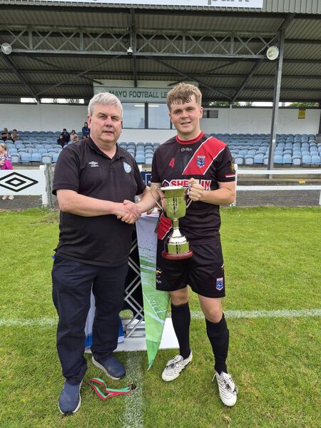 Mayo League chairman Gerry Sweeney presenting the Tuohy Cup to Iorras Aontaithe captain Billy O'Connor. Mayo League chairman Gerry Sweeney presenting the Tuohy Cup to Iorras Aontaithe captain Billy O'Connor.